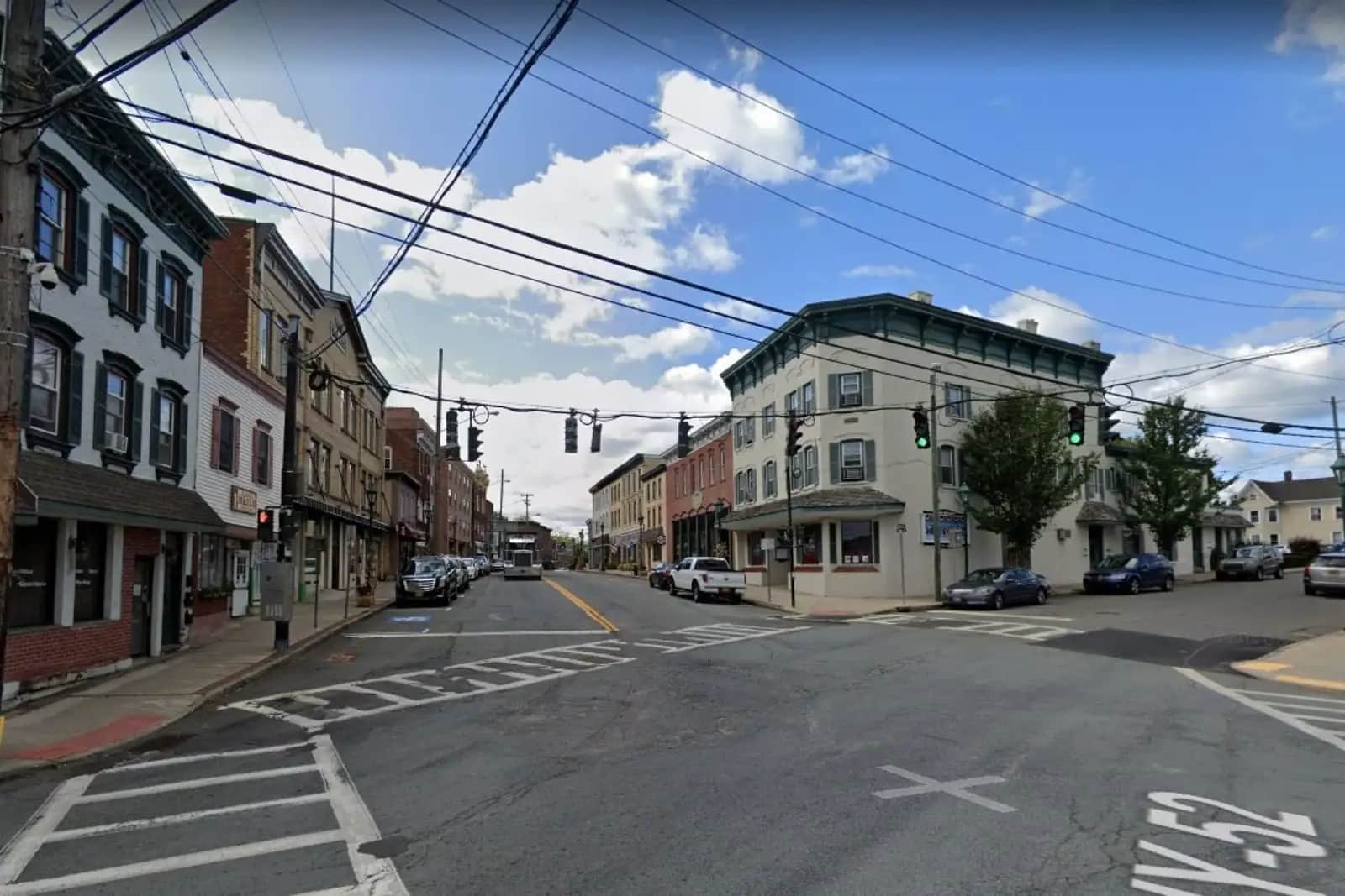 Street intersection with storefronts and overhead utility lines